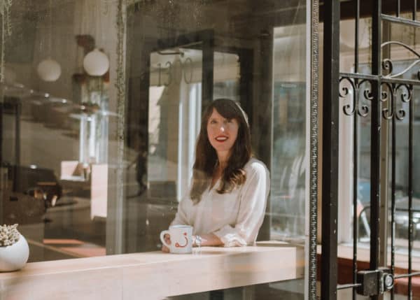 Founder, Eileen, sitting at Ritual cafe